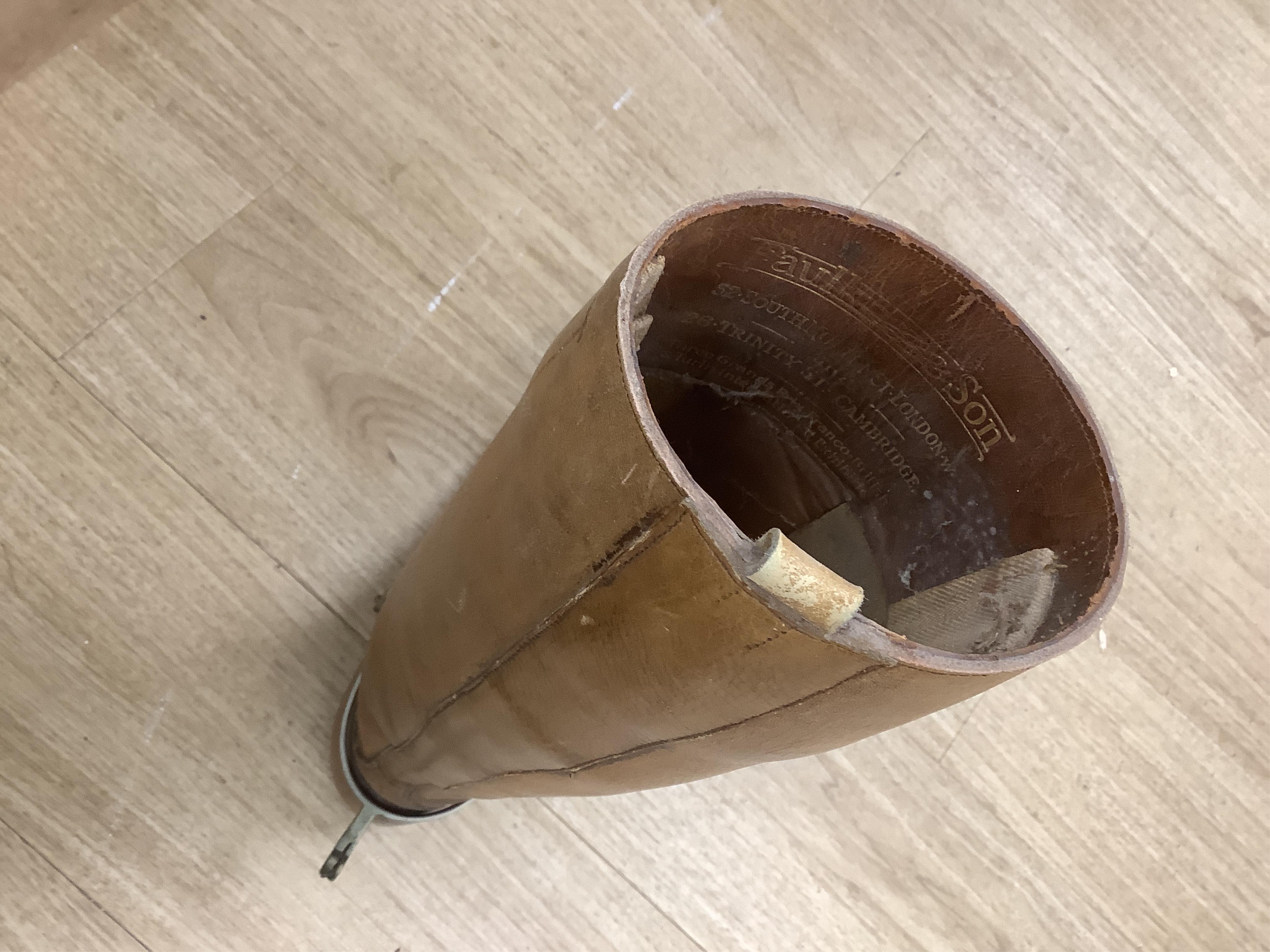 A pair of military First World War boots in tan leather, hobnail soles, two-part wooden shoe trees, and spurs. Condition - fair to good, some rubbing, fading and staining to the leather
